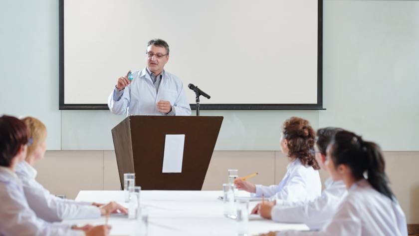 Researcher speaking at conference
