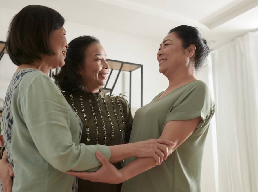 Hugging Senior Friends