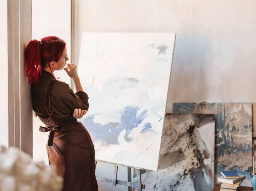 Young creative woman artist standing